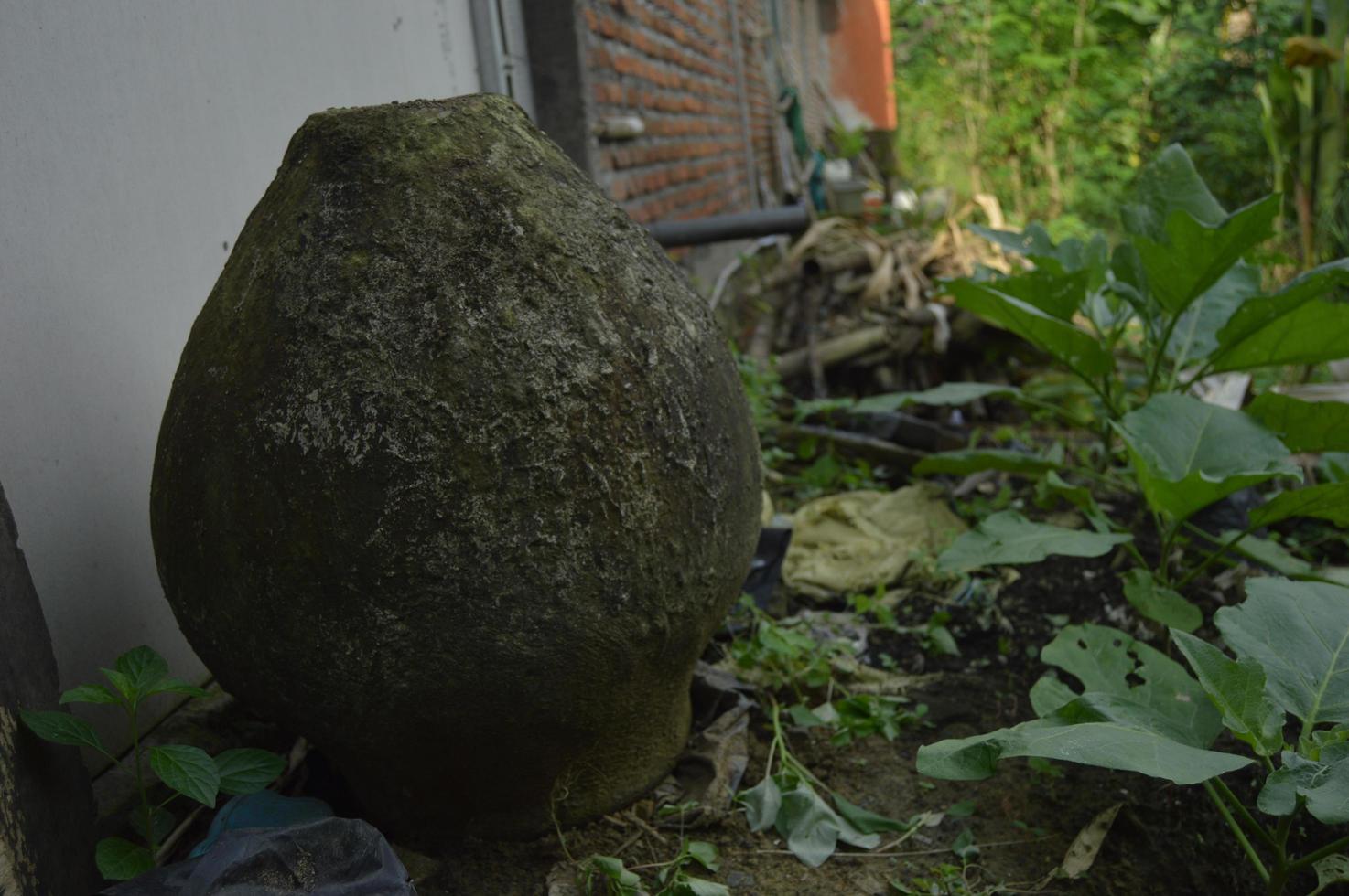 Vintage water reservoir. Made of strong cement cast. traditional water reservoir from Indonesia. Outdoor photo shoot.