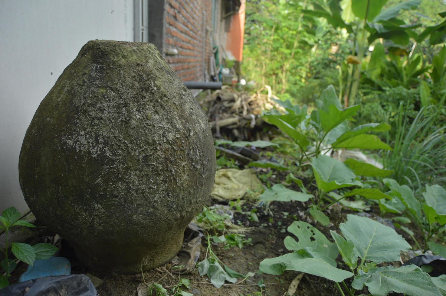 Vintage water reservoir. Made of strong cement cast. traditional water reservoir from Indonesia. Outdoor photo shoot.