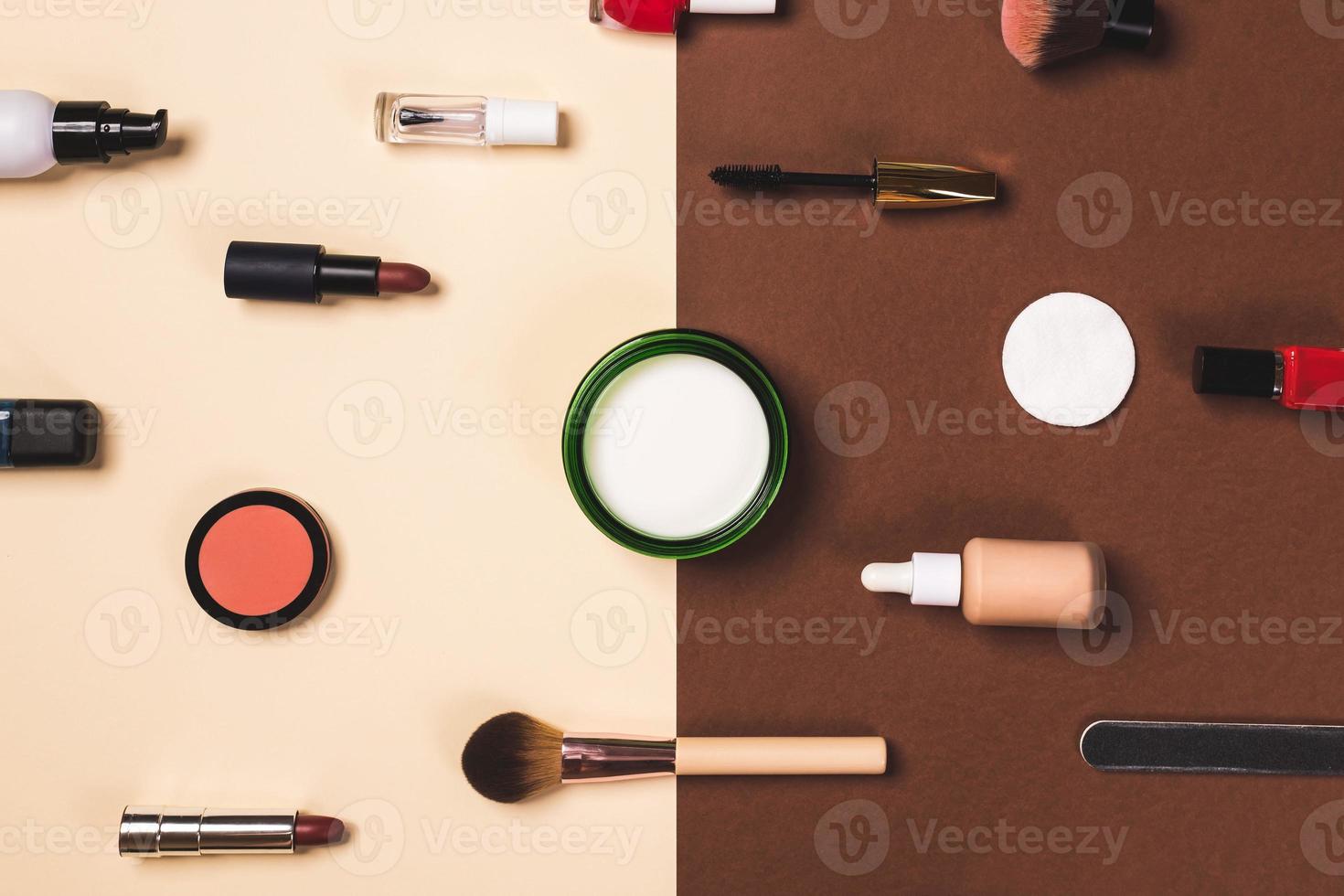 make up stuff on a brown red and cream color background photo