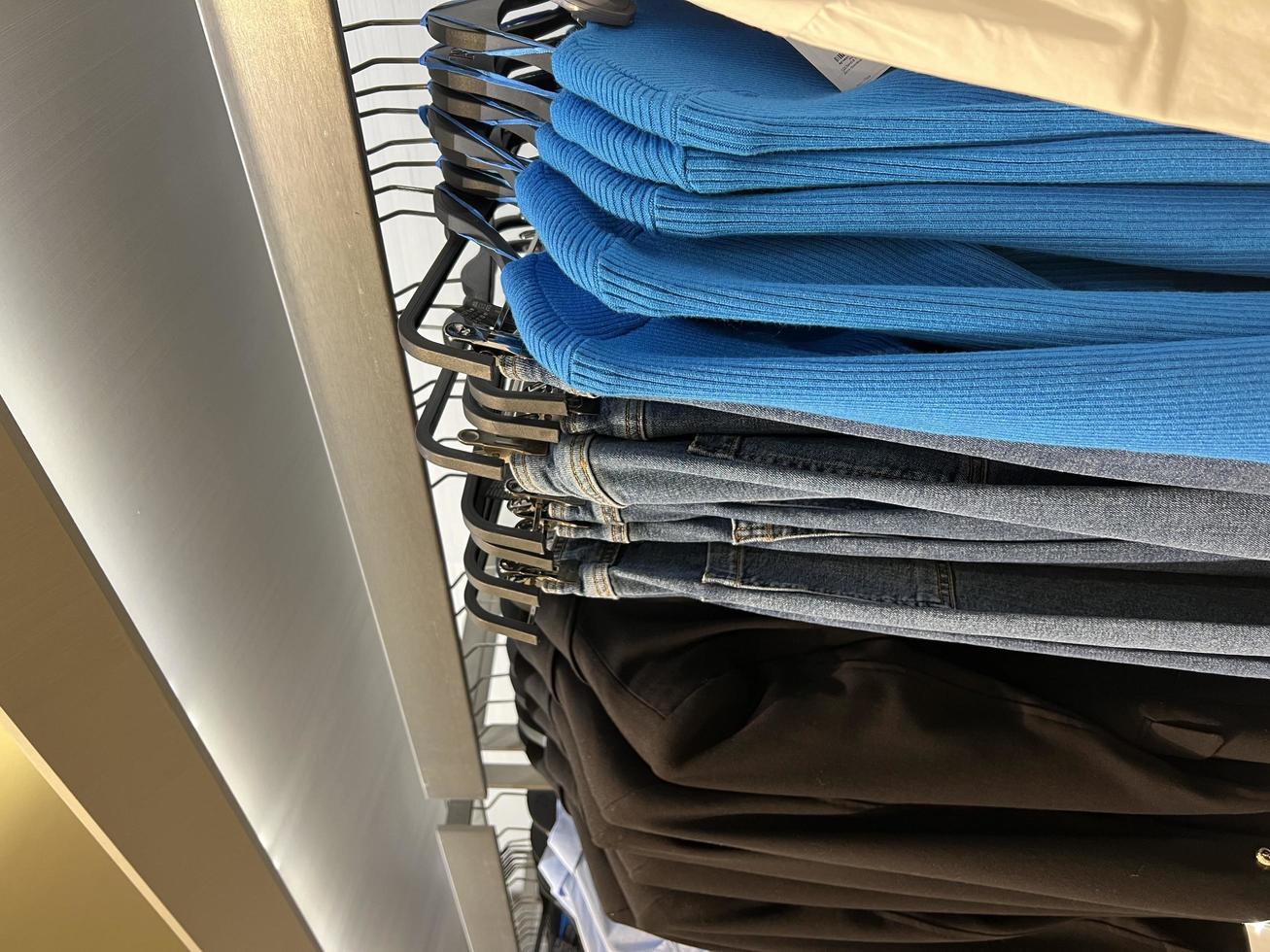 clothing store. things on a hanger in a store. wardrobe woman. sale mall photo