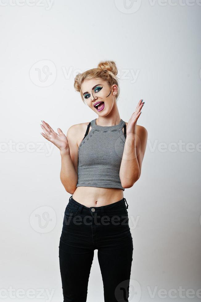Studio shot of anime girl with bright and colorful makeup on white background photo