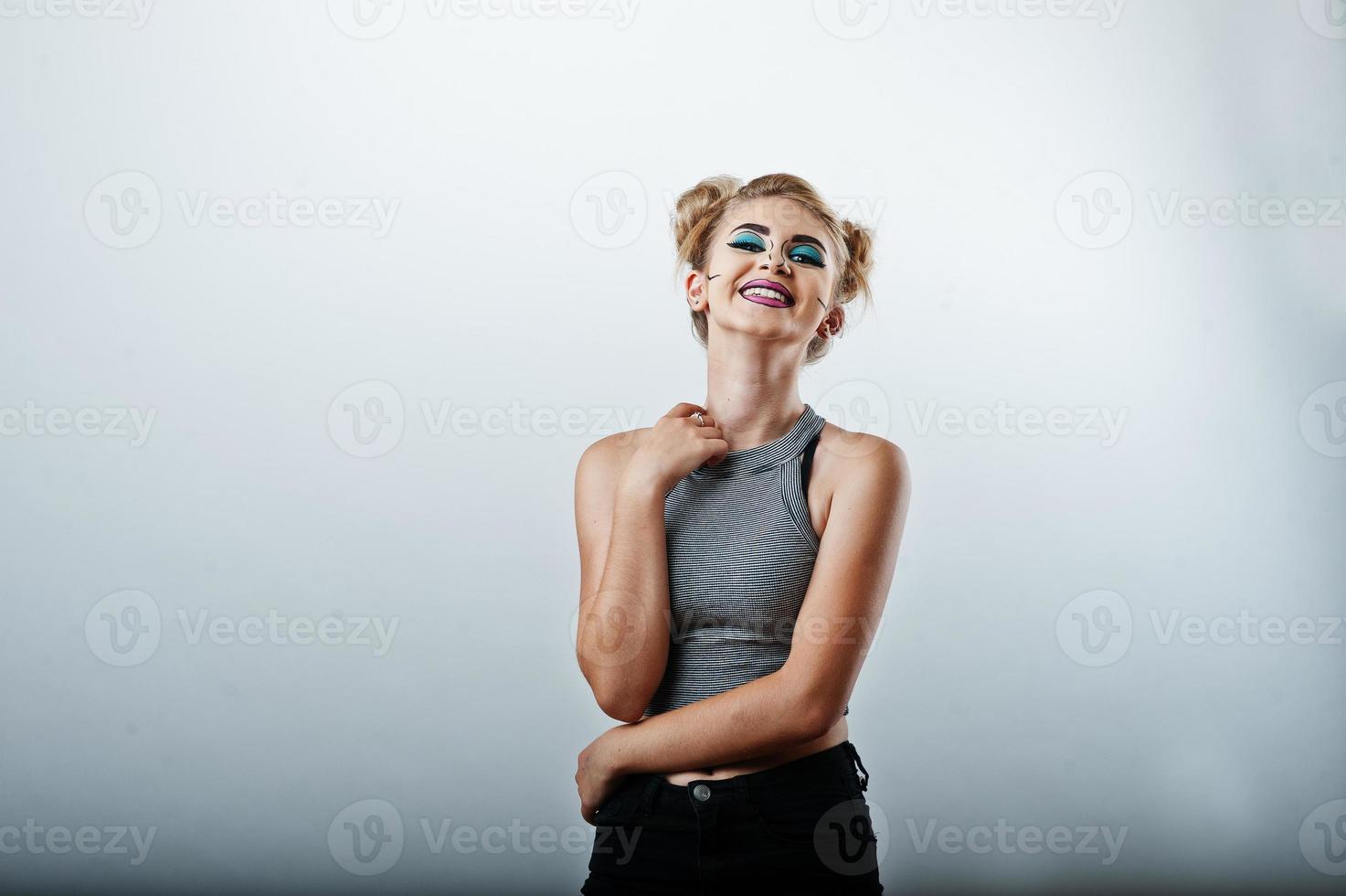 Studio shot of anime girl with bright and colorful makeup on white background photo