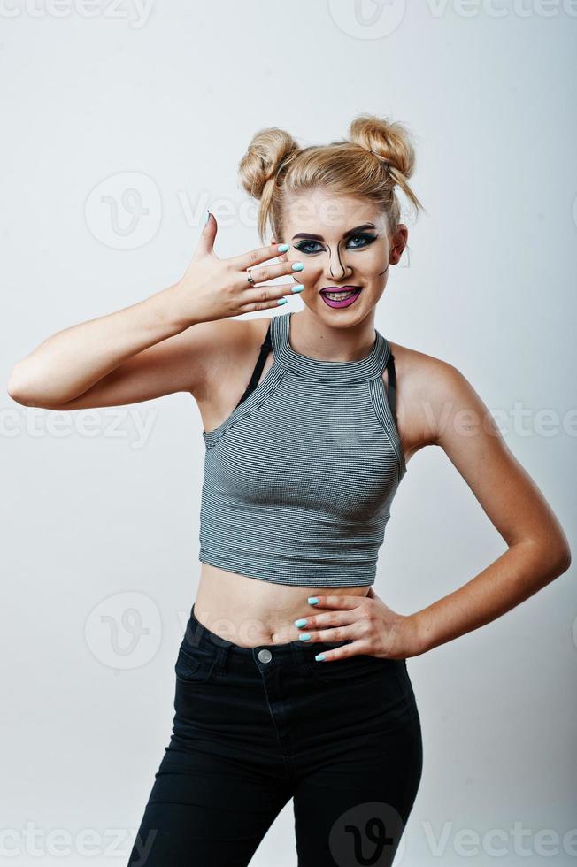 Studio shot of anime girl with bright and colorful makeup on white background photo