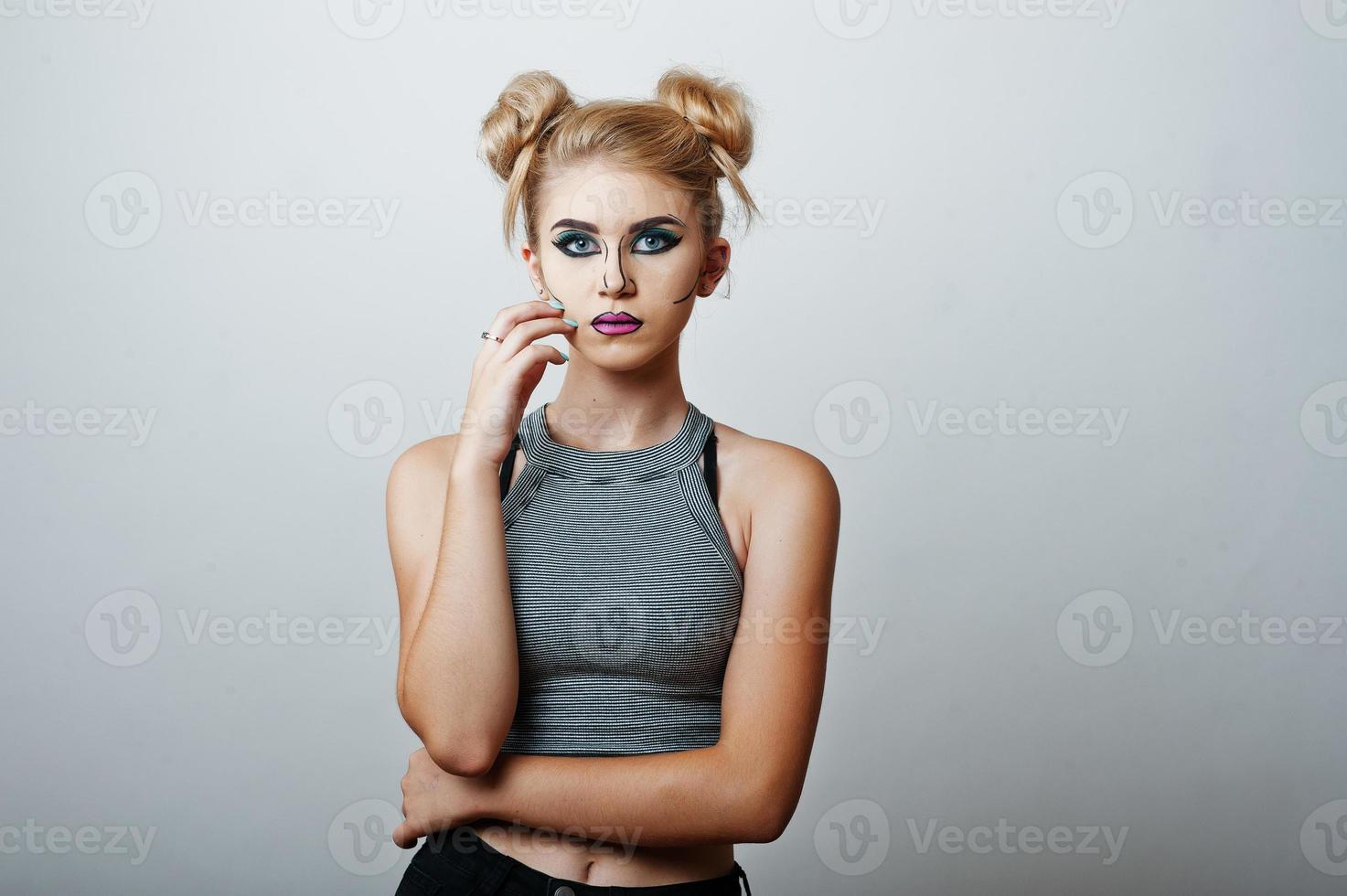 Studio shot of anime girl with bright and colorful makeup on white background photo