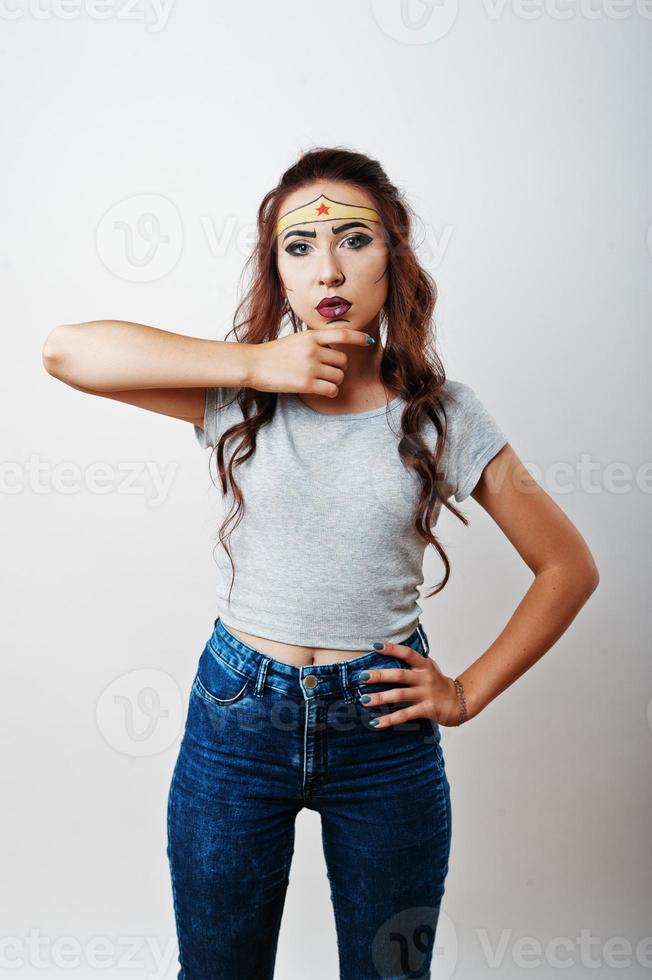 Studio portrait of girl with asian appearance and bright make up with red star on forehead photo