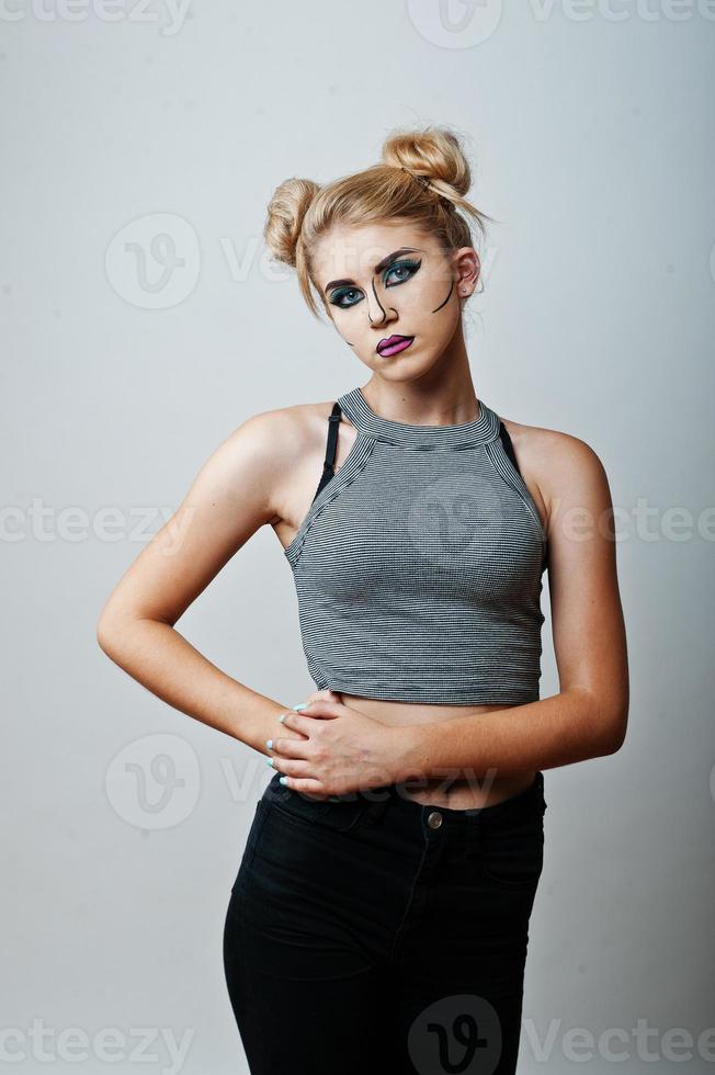 Studio shot of anime girl with bright and colorful makeup on white background photo