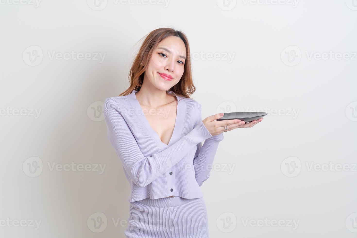 portrait beautiful Asian woman holding empty plate photo