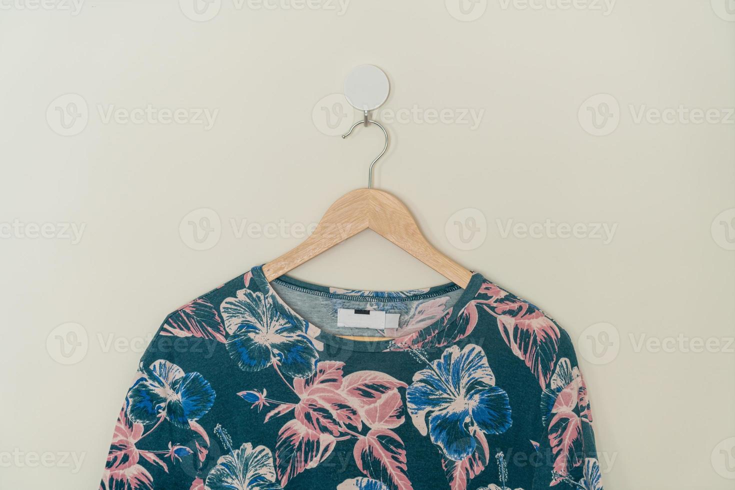 t-shirt hanging with wood hanger photo