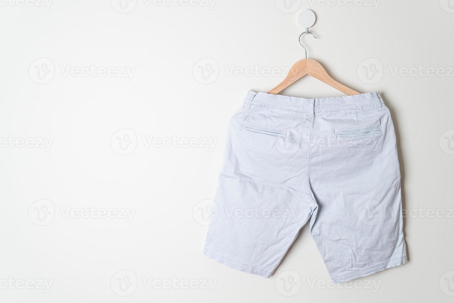 short pants hanging on wall photo