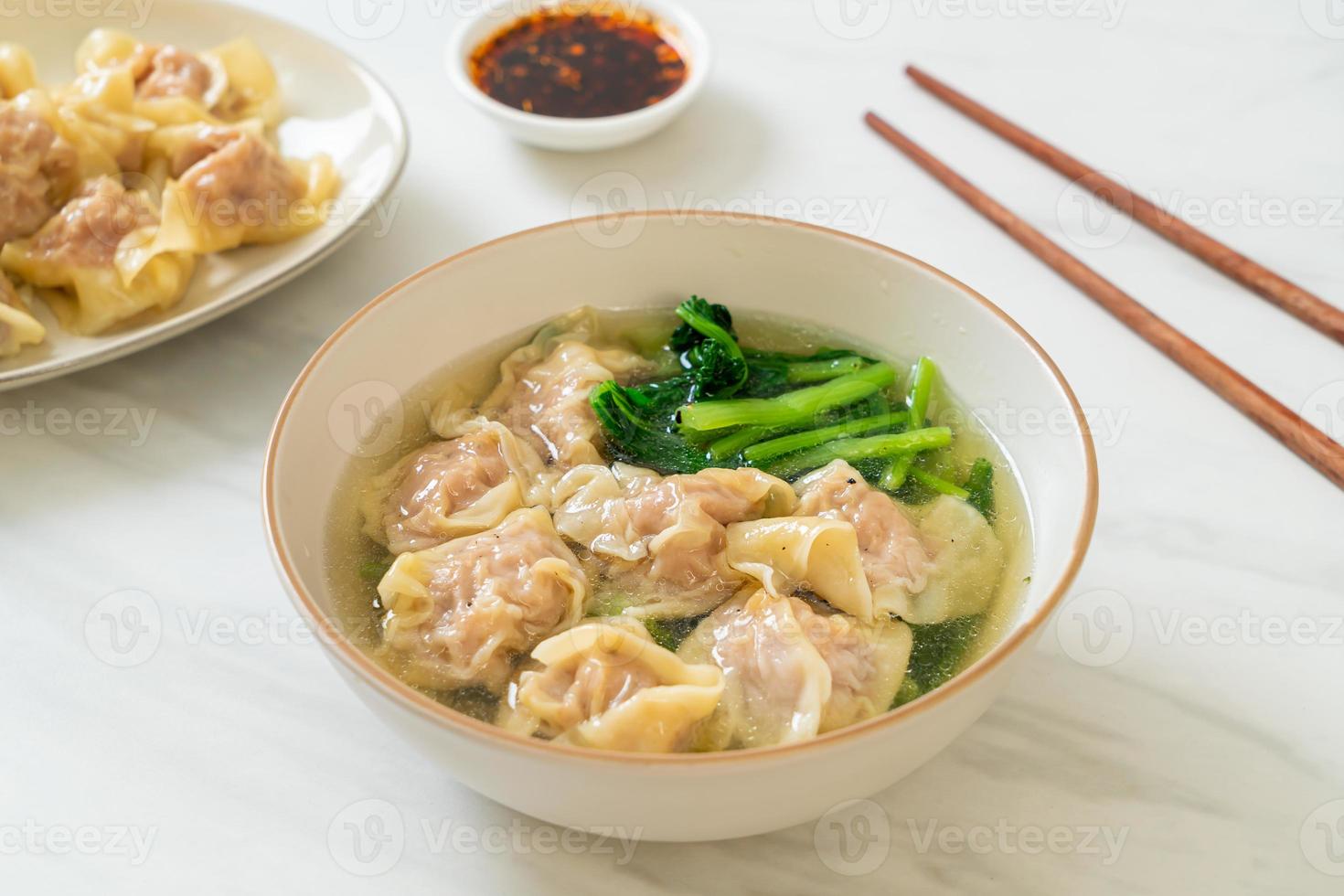 pork wonton soup or pork dumplings soup with vegetable photo