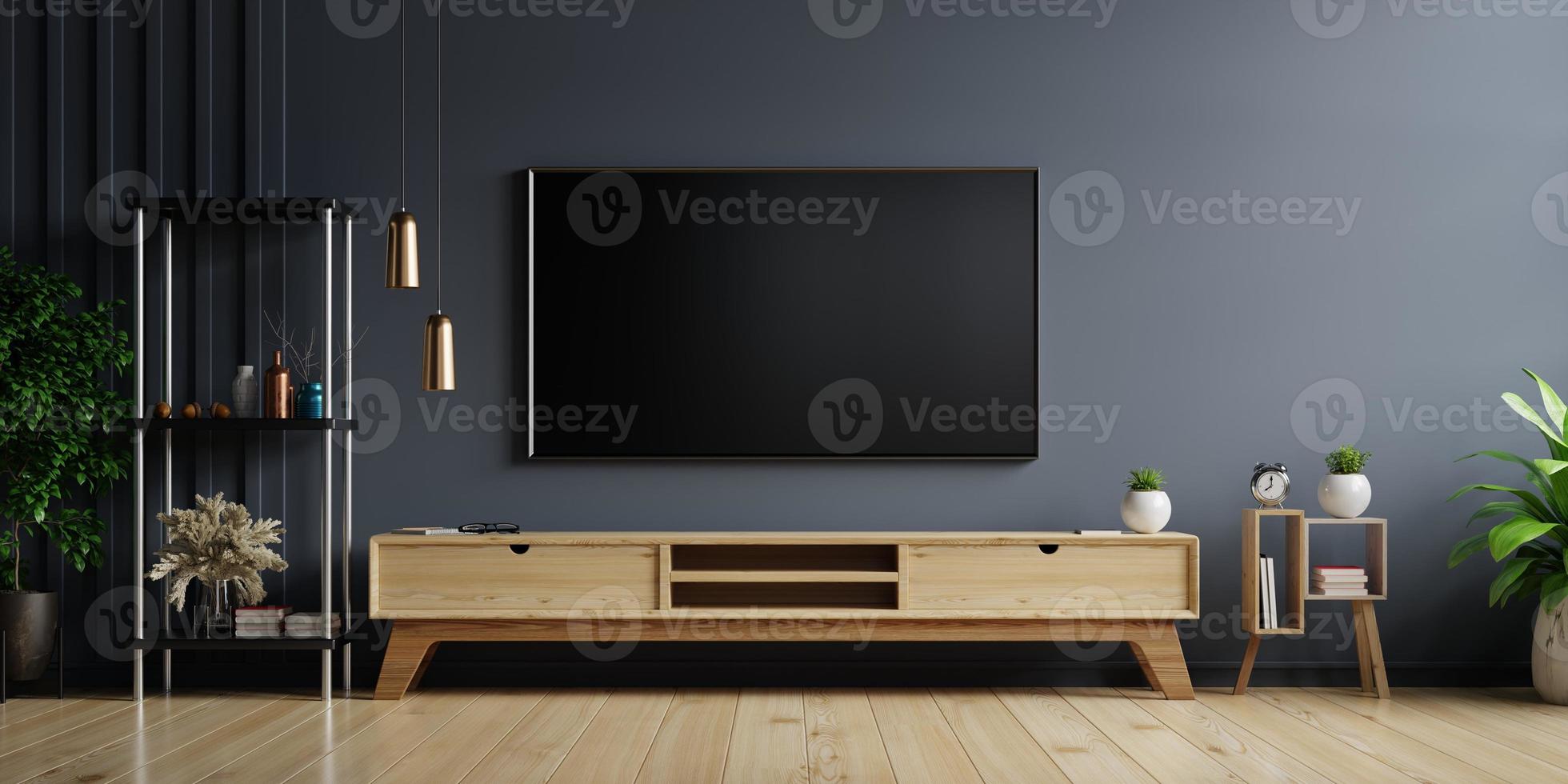 LED TV on the dark wall in living room with wooden cabinet,minimal design.  6168489 Stock Photo at Vecteezy