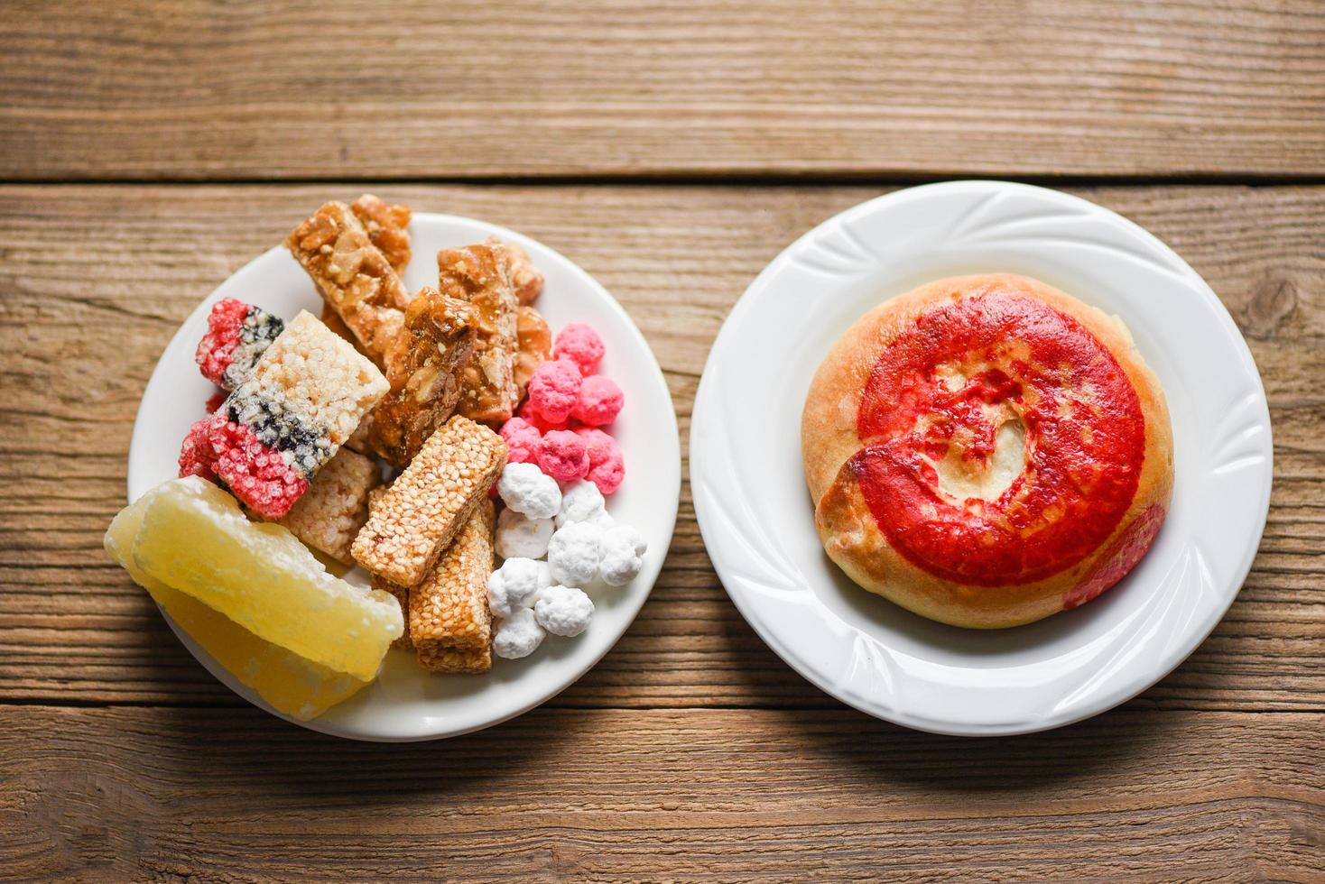 Chinese desserts, Snack mix nuts candies sweets sugar sliced nuts sesame seeds coated beans grains puffed rice candied winter melon, Thai and chinese pay respect to god in chinese new year festival photo