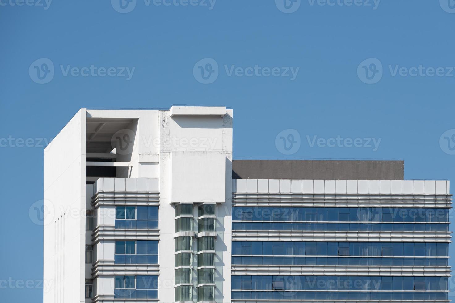 Part of modern urban glass mixed buildings is in blue sky and good weather photo