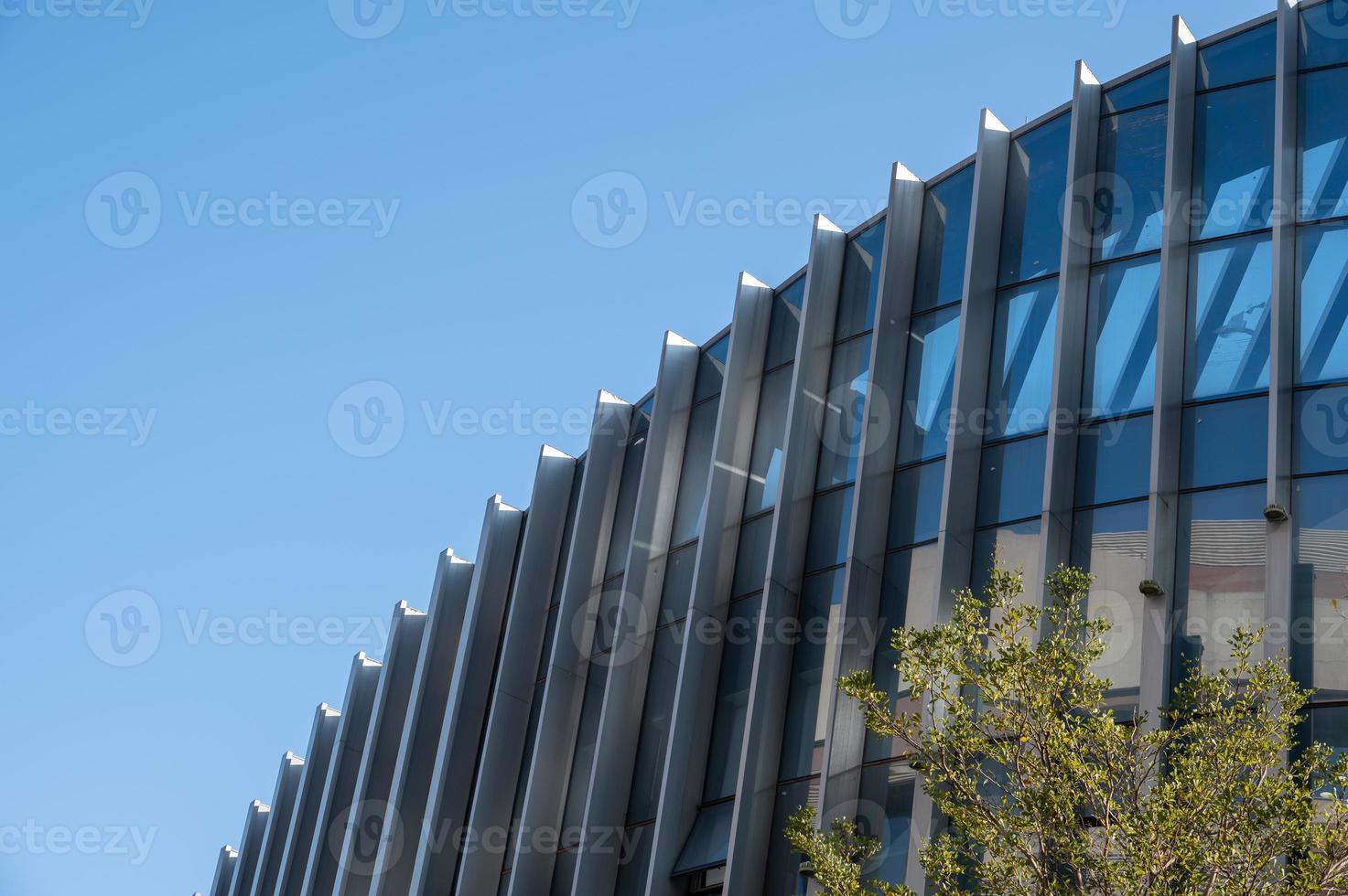 Part of modern urban glass mixed buildings is in blue sky and good weather photo