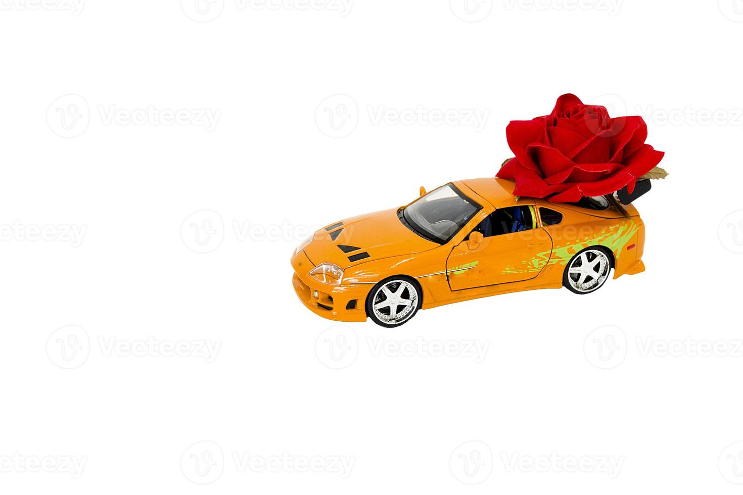 toy car with roses on white background photo