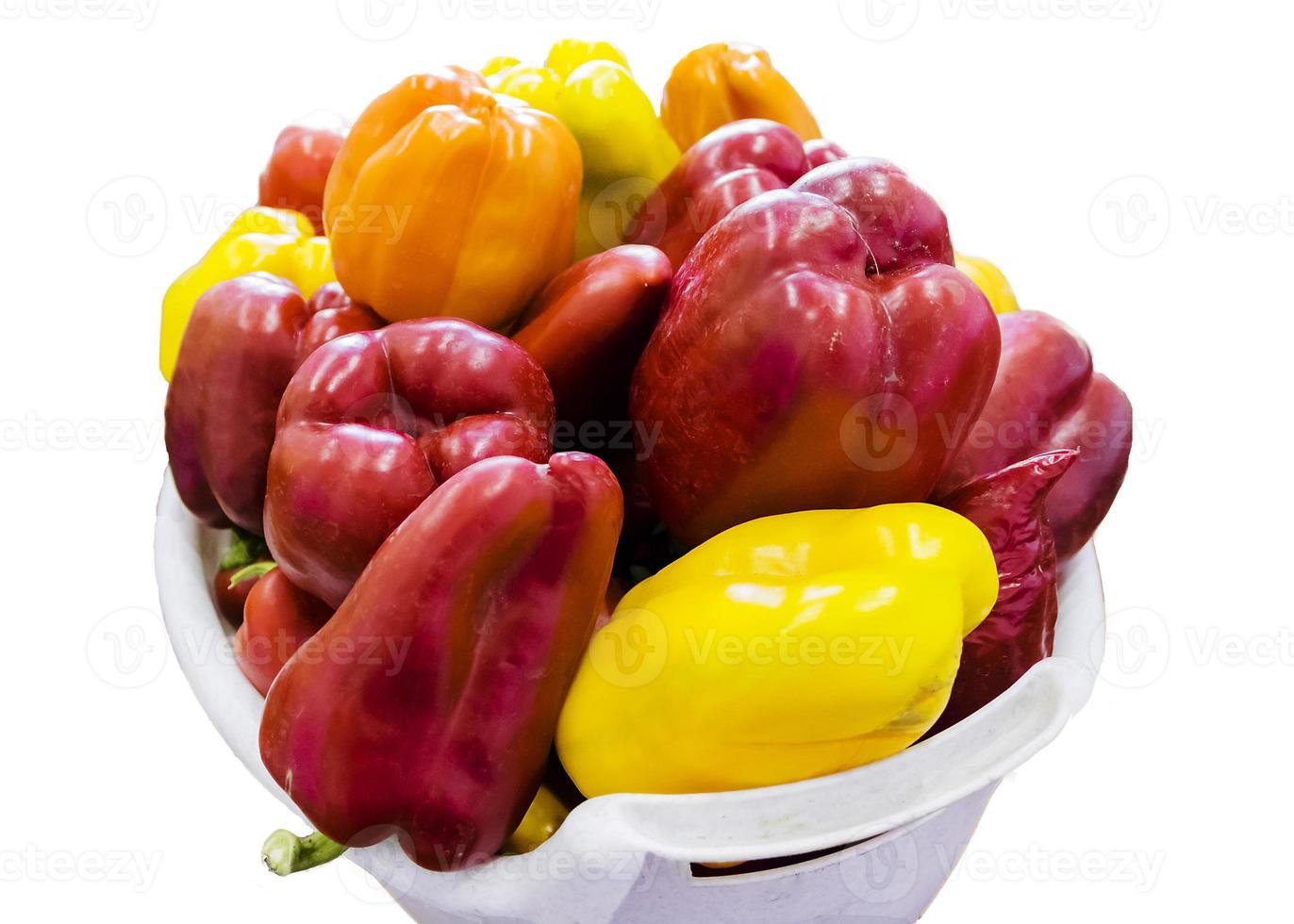 Red and yellow sweet bell peppers on table, close up photo