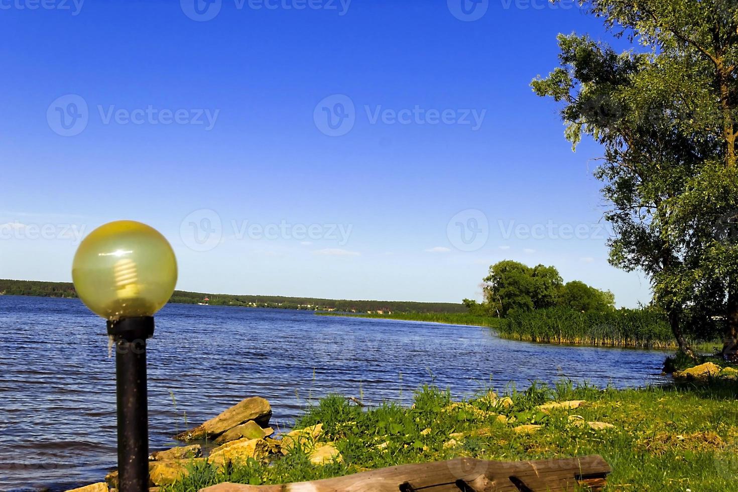 beautiful landscape with river near the forest photo