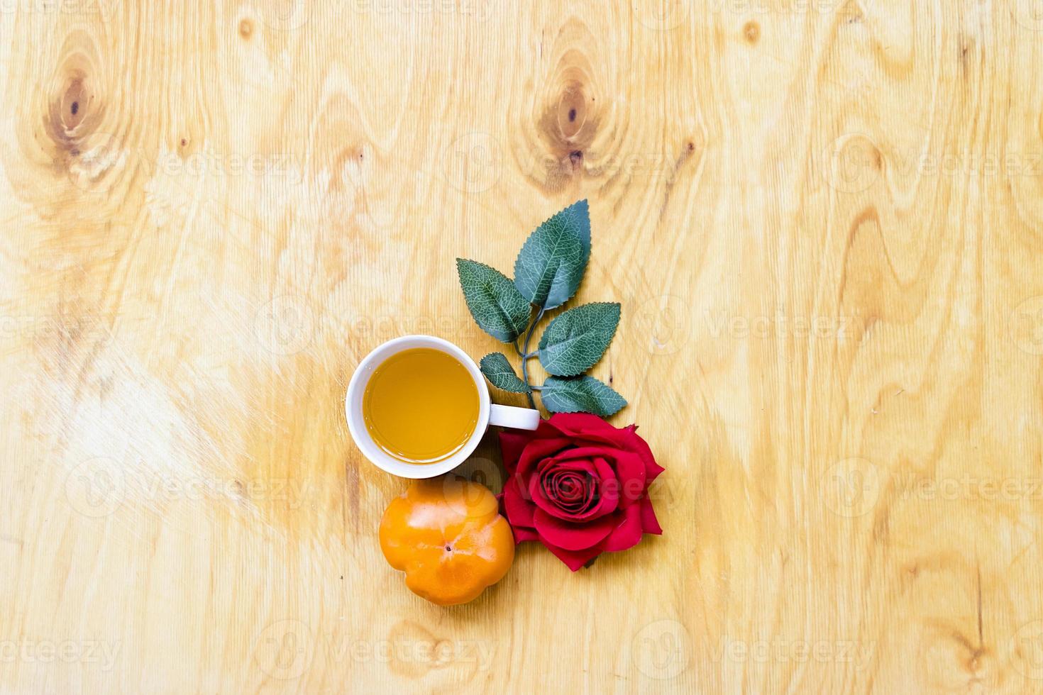 Fresh banana and persimmon in brick wall background and wooden table, photo