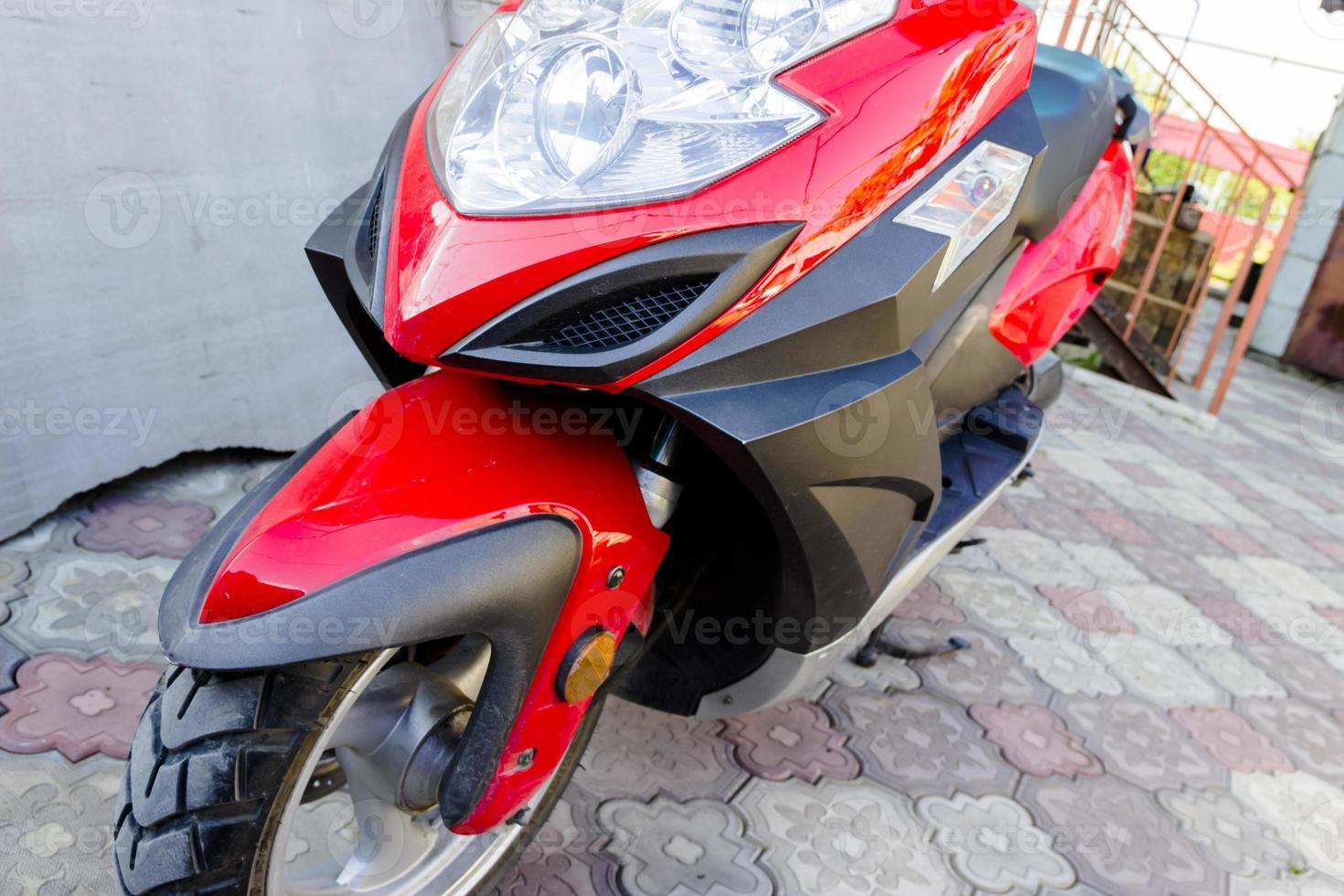 Closeup of red motorcycle. Beautiful modern red motorcycle photo