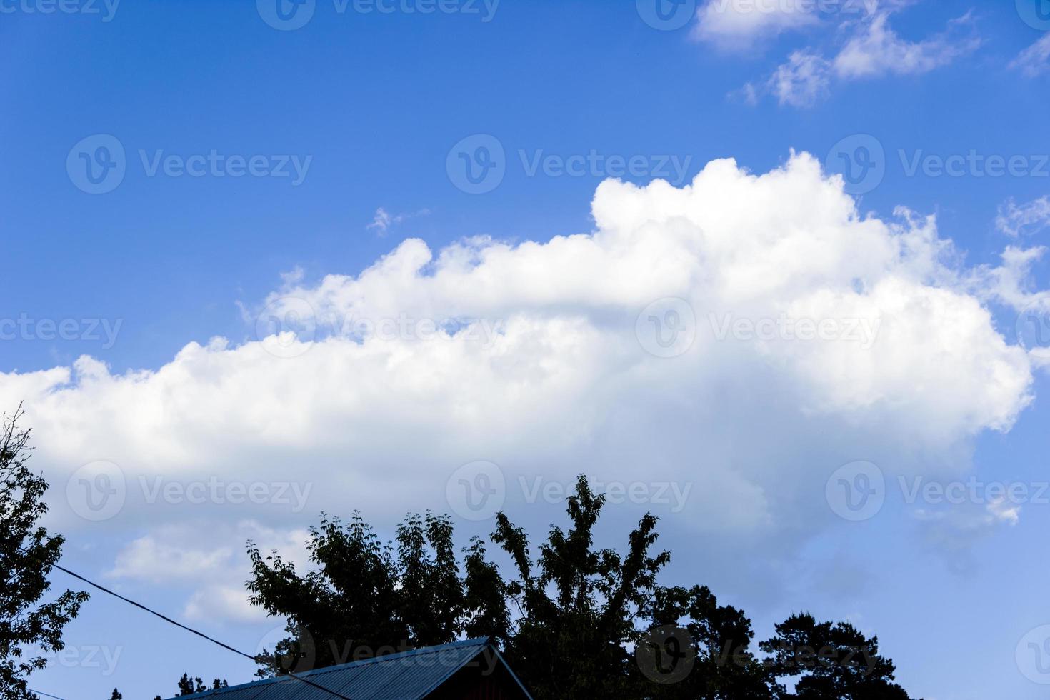 Clouds and blue sky background with copy space photo