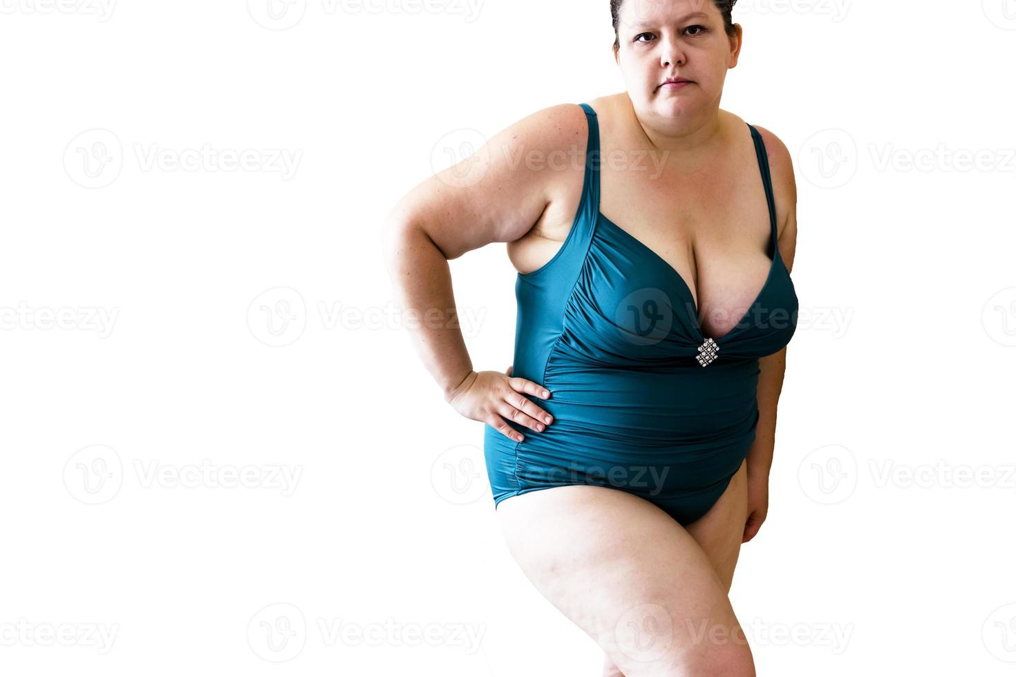 young woman posing in a turquoise swimwear on white background photo