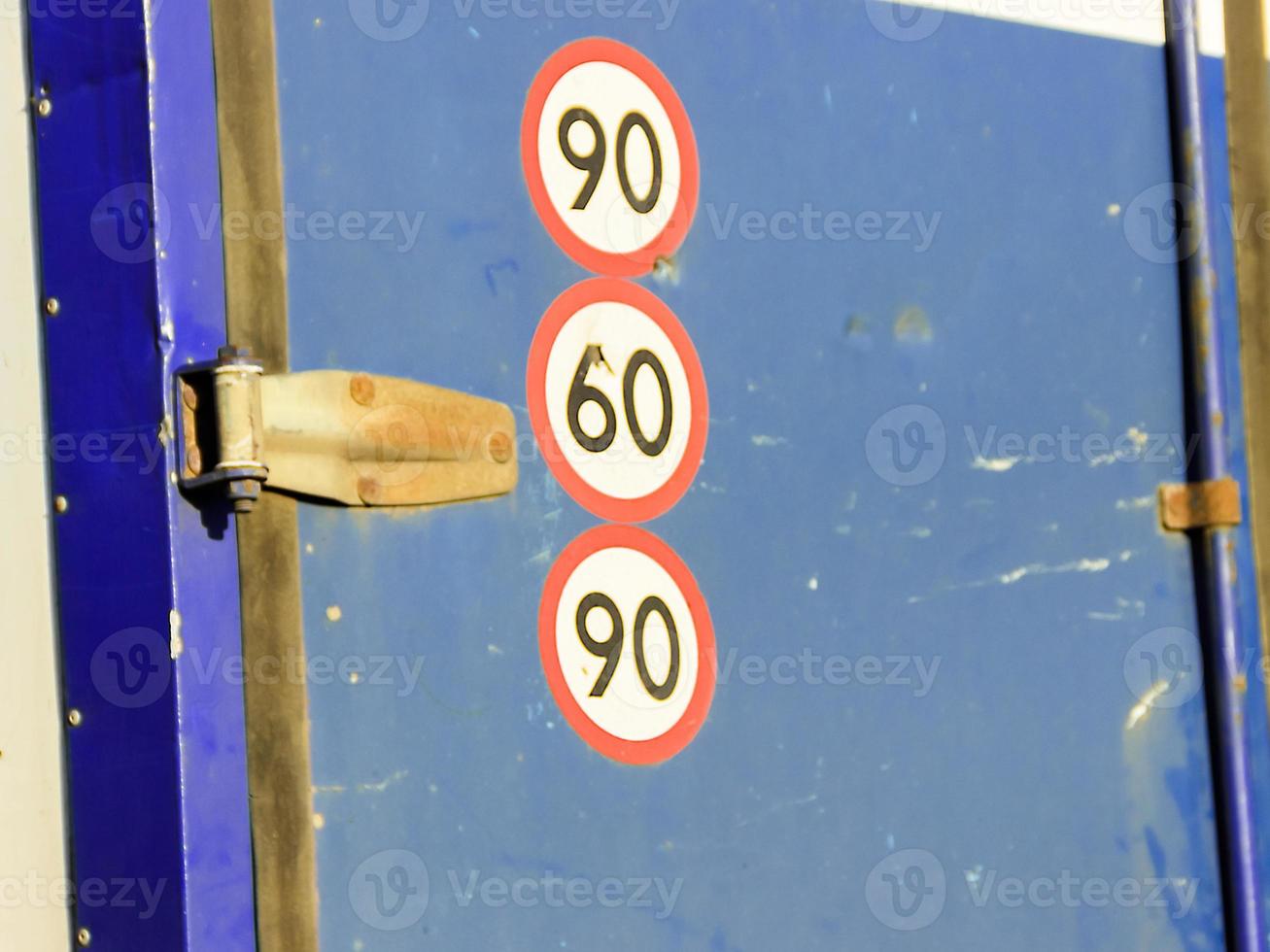 eight speed restriction sign on red corrugated background photo