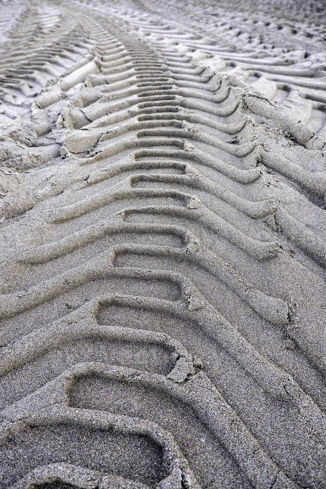 Wheel tracks on the beach photo