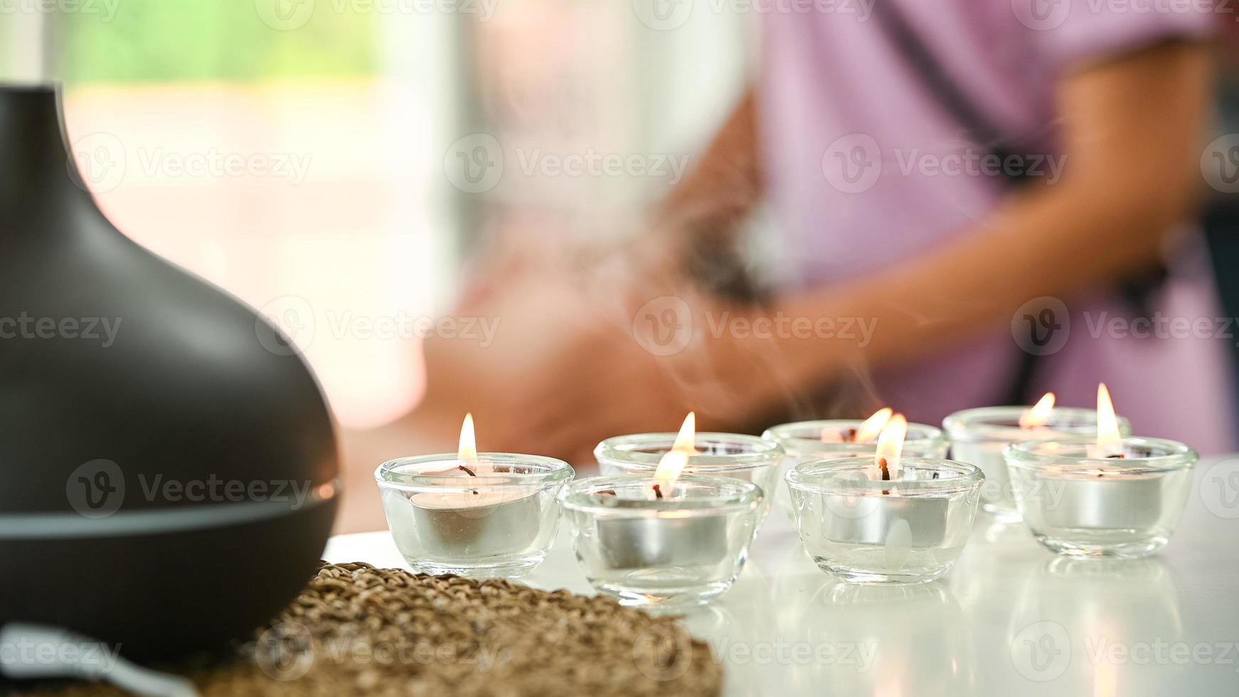 Portrait of young beautiful asian woman enjoys massage in a luxury spa resort photo