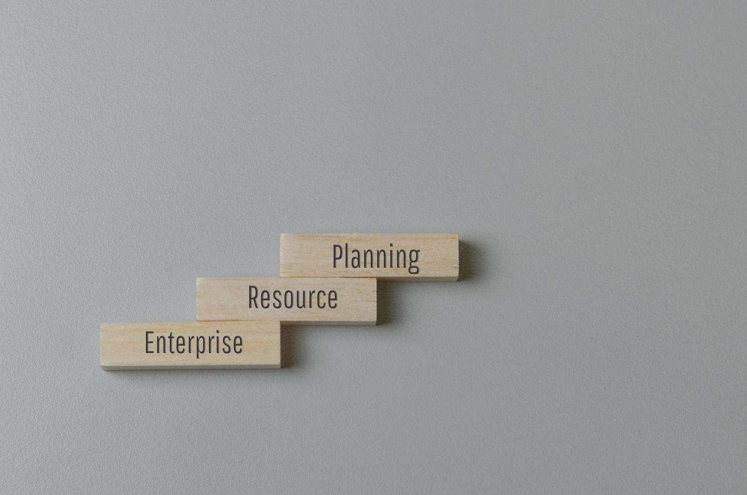 Wooden blocks with words ERP Enterprise Resource Planning on background and copy space.Business concepts. photo