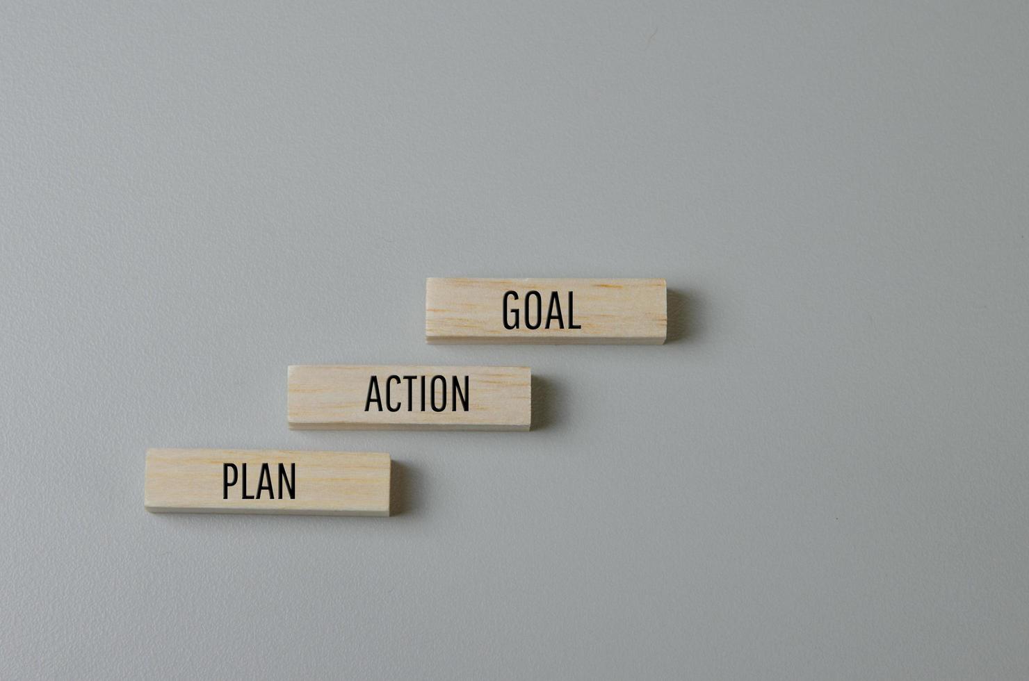 Wooden blocks with words Plan Action Goal on background and copy space.Business concepts. photo