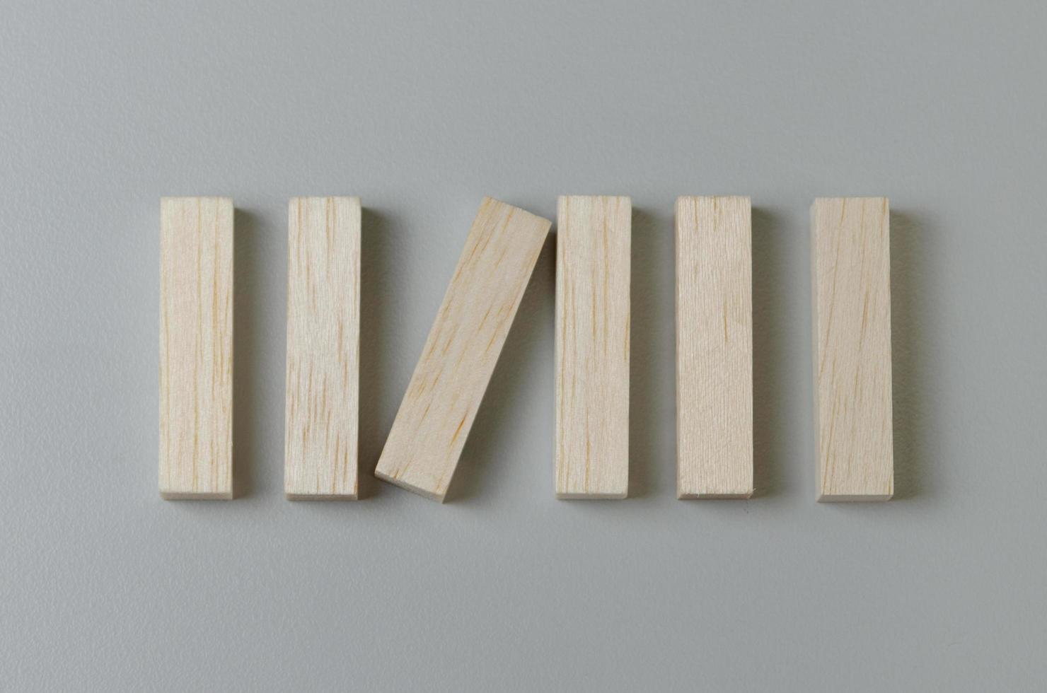 Blank wooden block for icons or symbols on gray background. photo