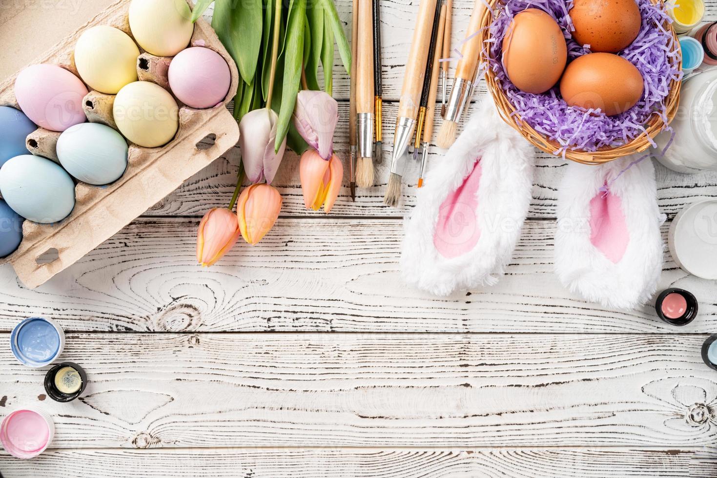 easter background with eggs with pastel paints, top view flat lay photo