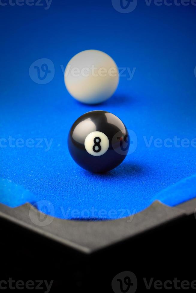 Match ball. Black eight ball in the pocket. photo