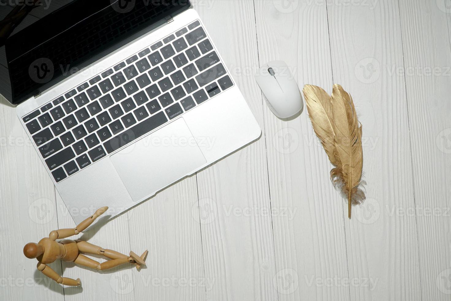 wood office desk table with laptop computer. Top view with copy space, flat lay. photo