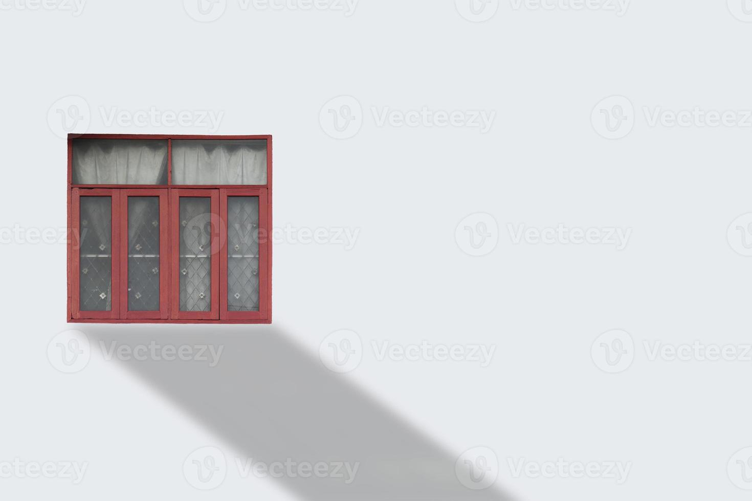 Front view of colorful window on white wall. photo