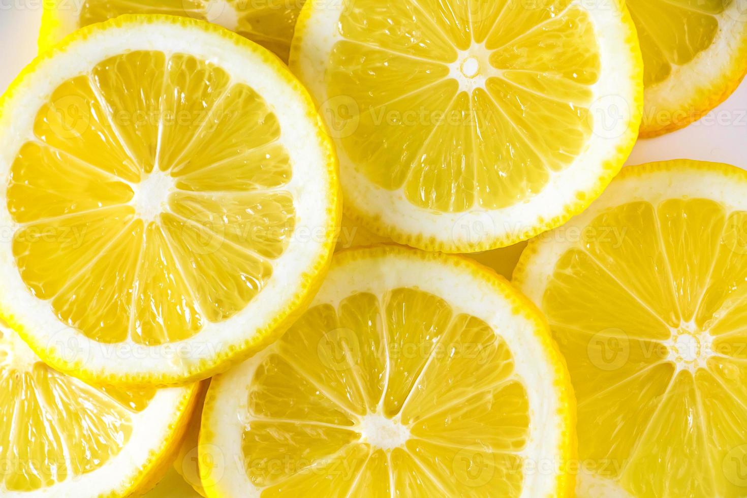 Background from fresh juicy lemons close-up. photo