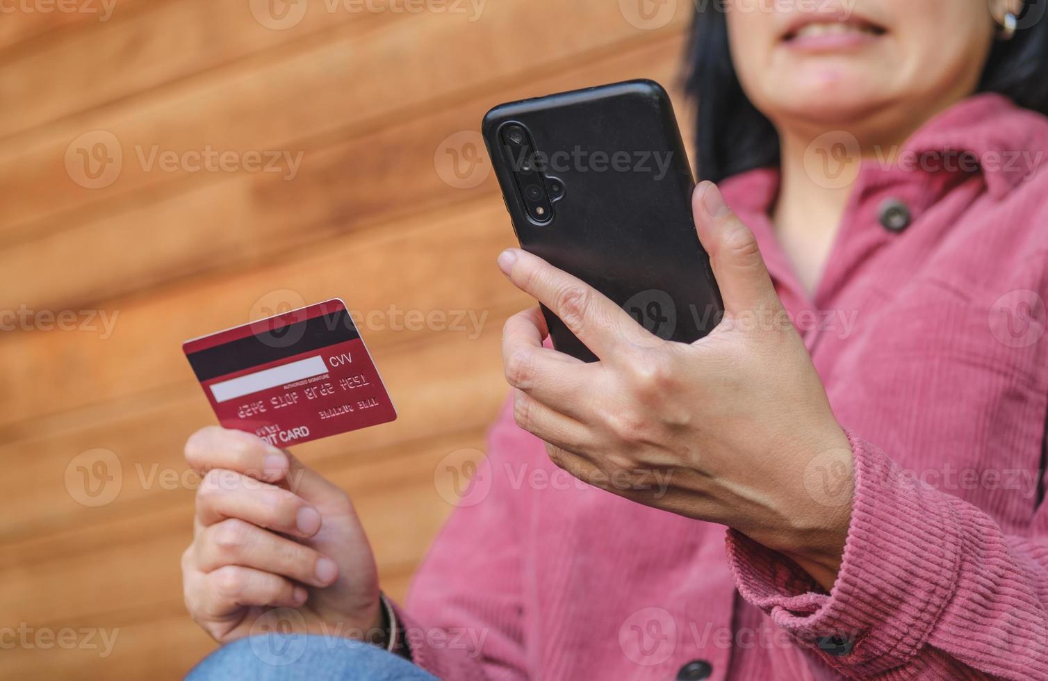 Asian woman use credit card pay contactless on mobile shopping app photo