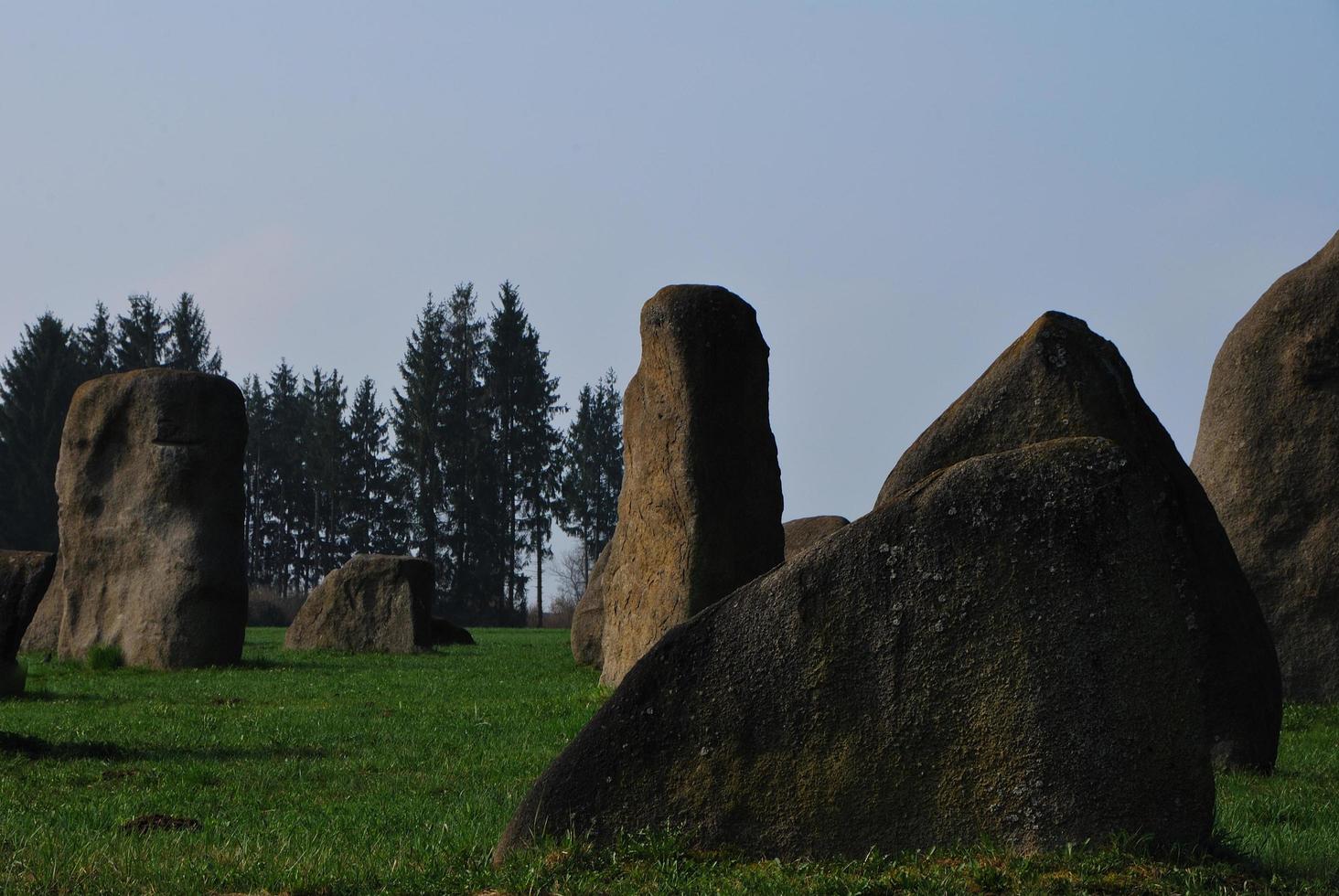 granite stones on meadow photo