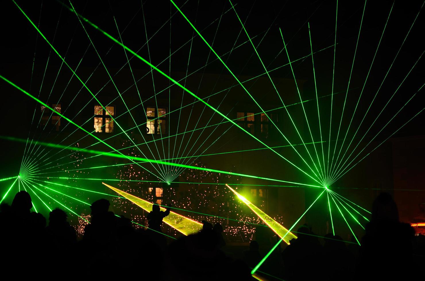 bright green laser show with people photo