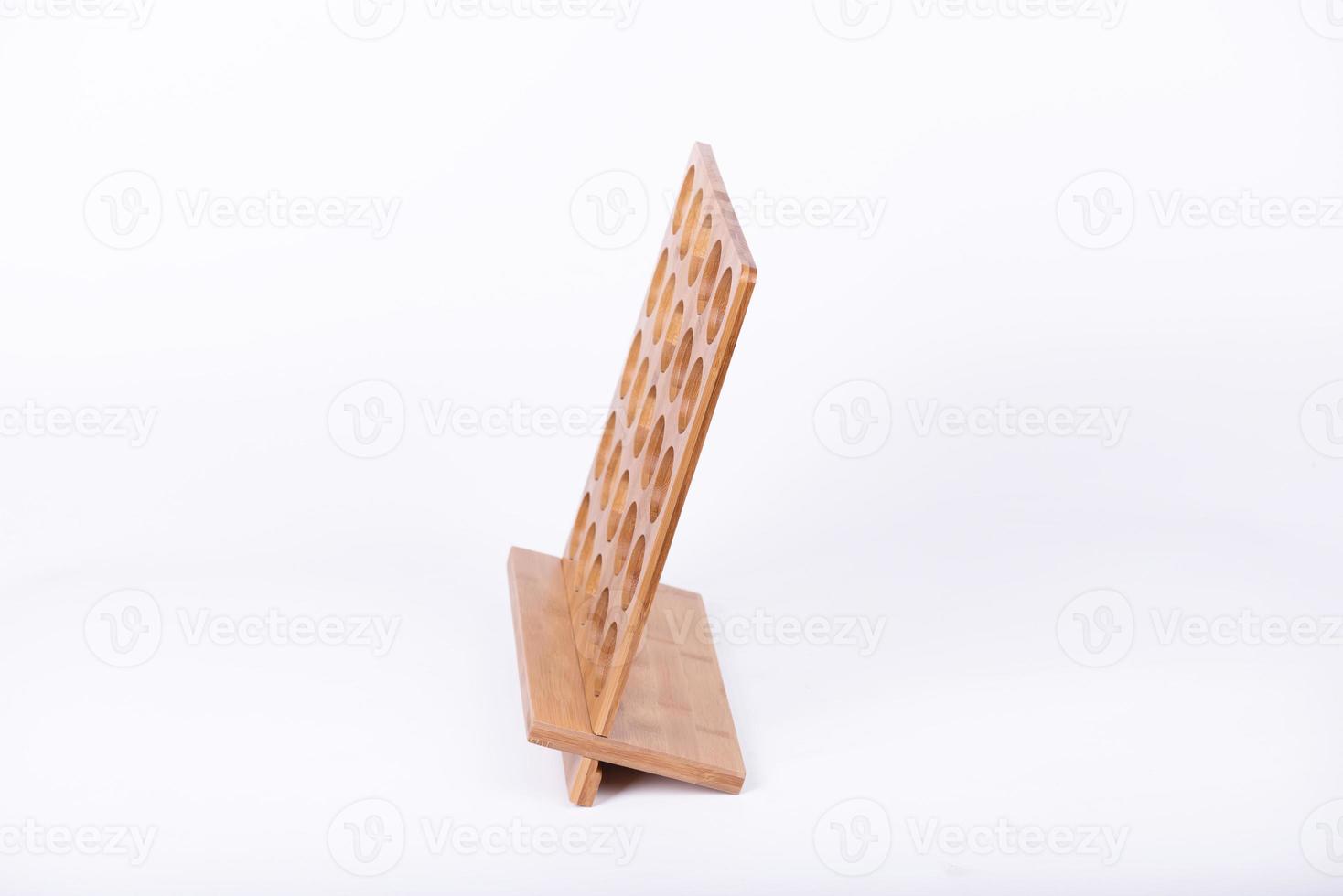 The small item storage rack made of bamboo is on a white background photo