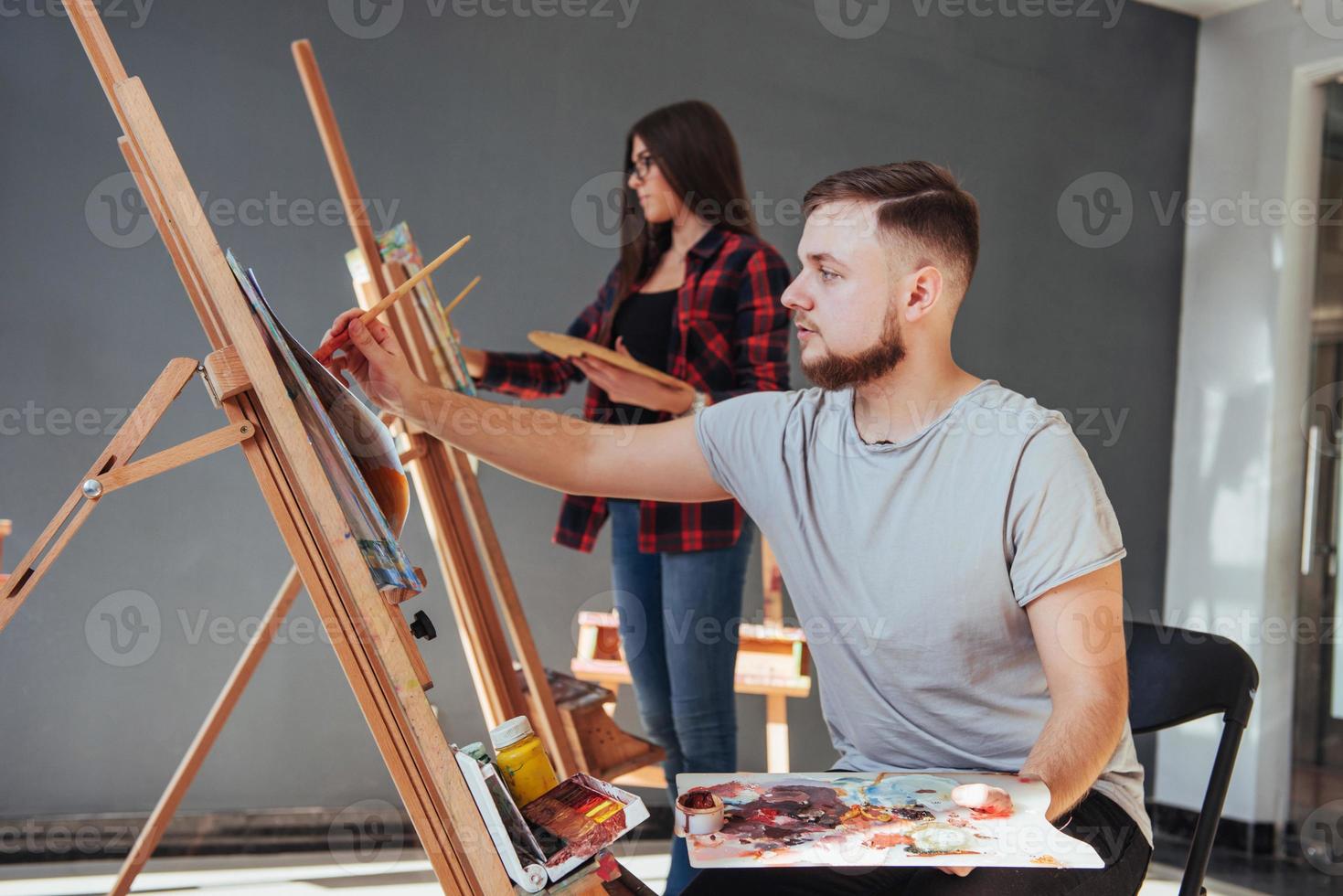 Creative artists have designed a colorful picture painted on canvas with oil paints in the studio photo