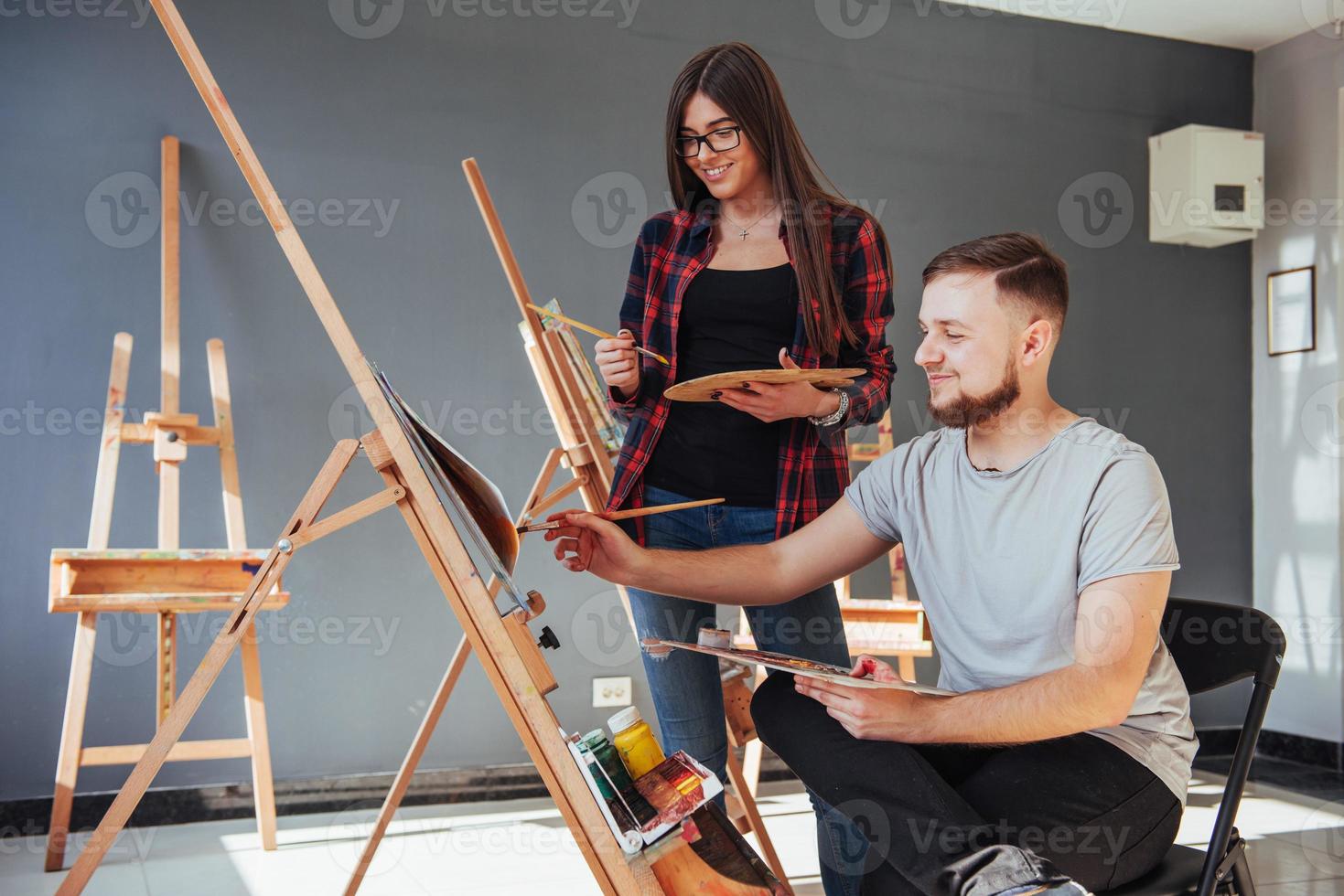 Creative artists have designed a colorful picture painted on canvas with oil paints in the studio photo