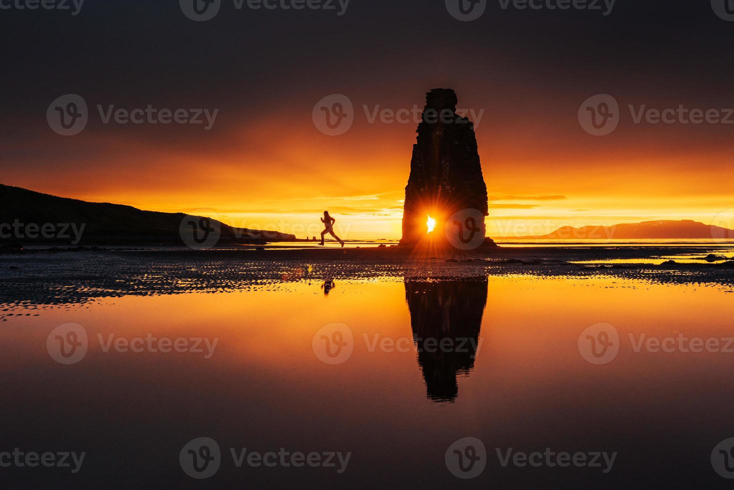 Hvitserkur 15 m height. Is a spectacular rock in the sea on the Northern coast of Iceland.  this photo  reflects in the  water after the midnight sunset.