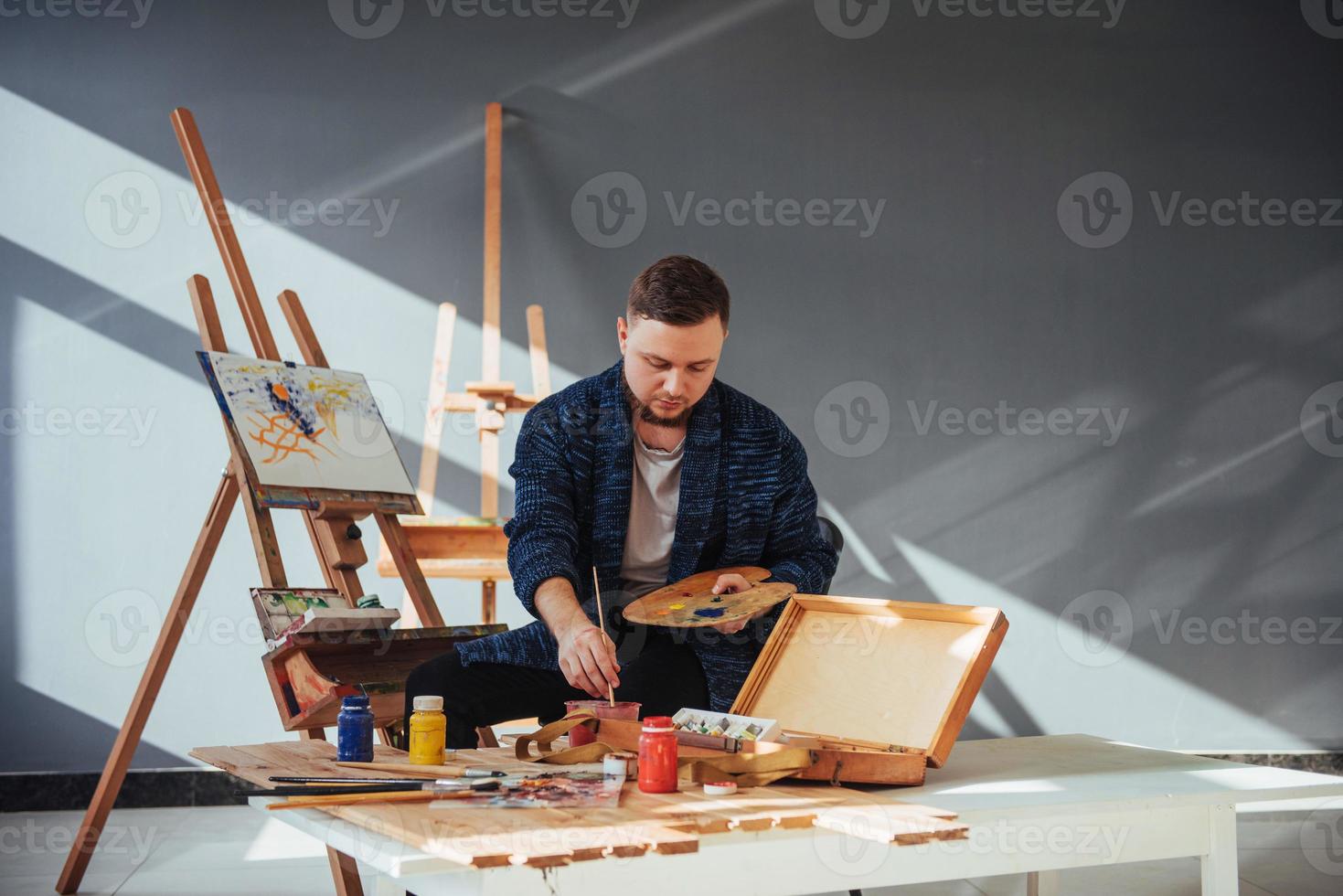 male artist in gallery photo