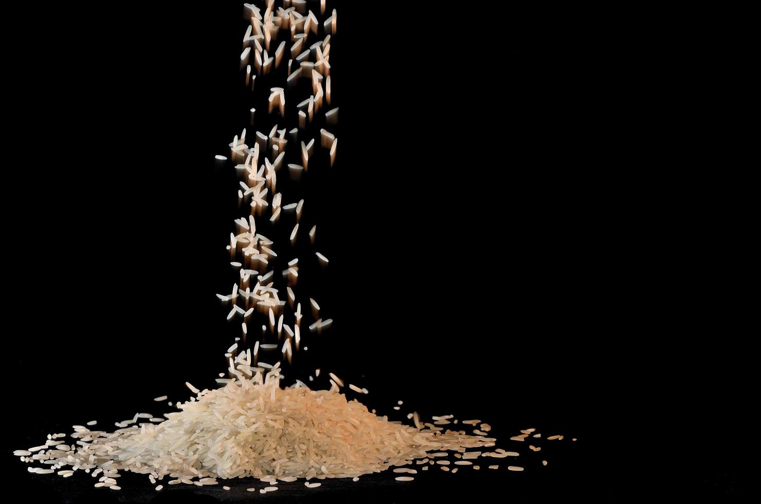 rice trickles on black photo