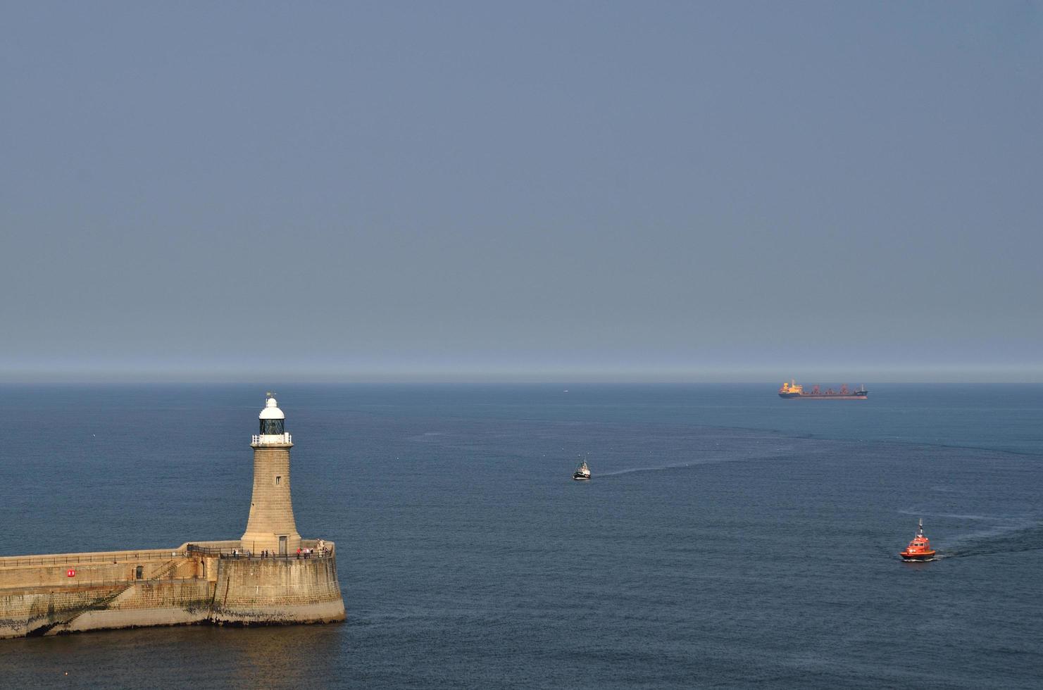 lighthouse with ships in newcastle photo