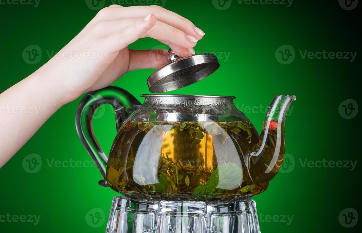 Mint tea in a transparent teapot photo