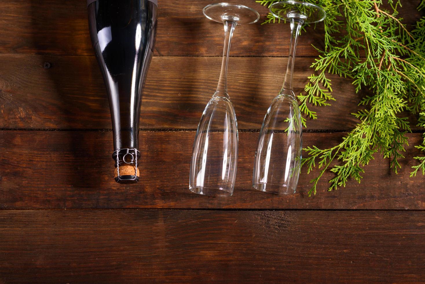 Christmas holiday table with glasses and a bottle of wine of champagne photo