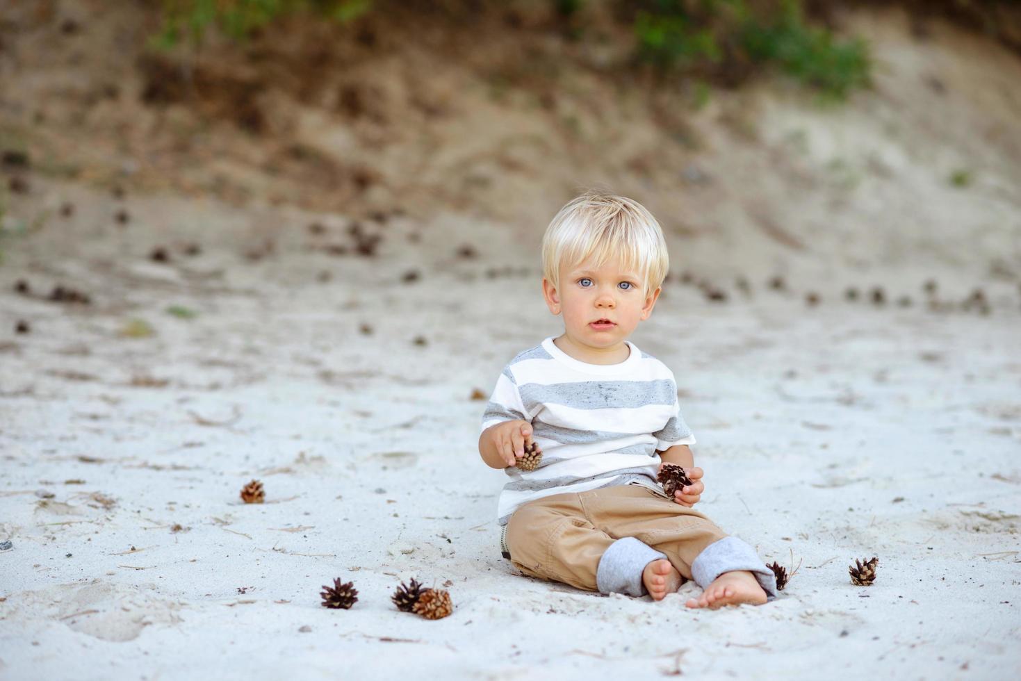 Cute boy with blond hair and blue eyes photo