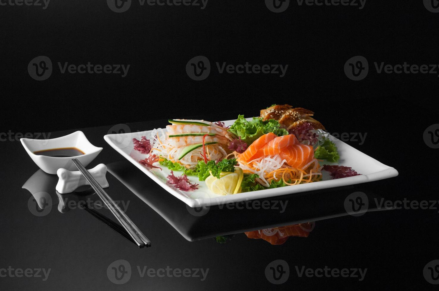 sushi in a plate on a black background photo